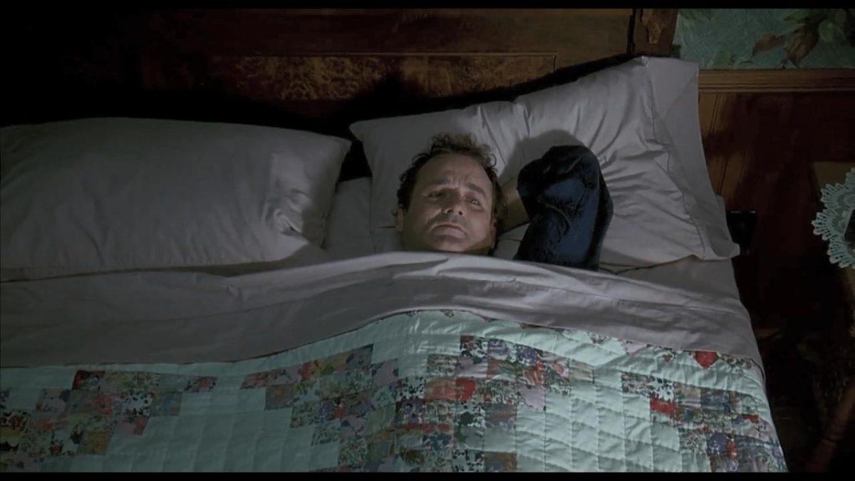Phil Connors (Bill Murray) waking up and contemplating suicide, in the romantic comedy "Groundhog Day." (Sony Pictures Home Entertainment)