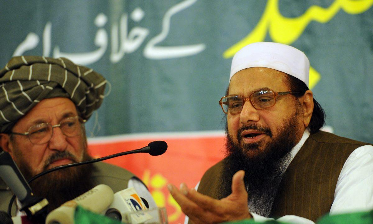 Hafiz Saeed (R), the founder of Lashkar-e-Taiba, talks to media representatives as Maulana Samiul Haq (L), chief of the Defense Council of Pakistan, and dubbed the father of the Taliban, looks on during a press conference in Rawalpindi on April 4, 2012. (Aamir Qureshi/AFP/Getty Images)
