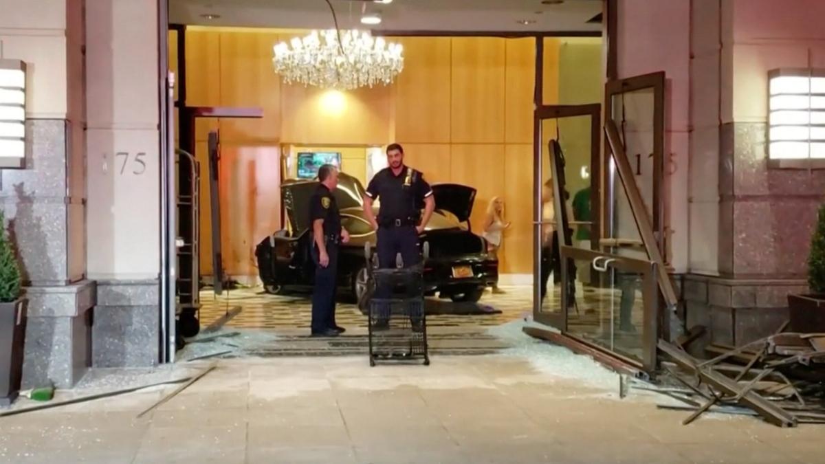 A car crashes into the glass entrance of the lobby at Trump Plaza in New Rochelle, N.Y., on Sept. 17, 2019. (Video screenshot/Courtesy of Jose Abarca via Reuters)