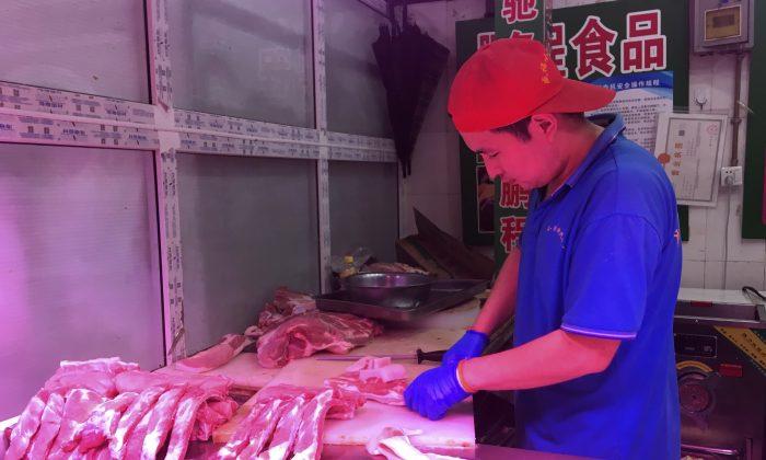 China Releases Stockpiled Pork to Cool Price Surge
