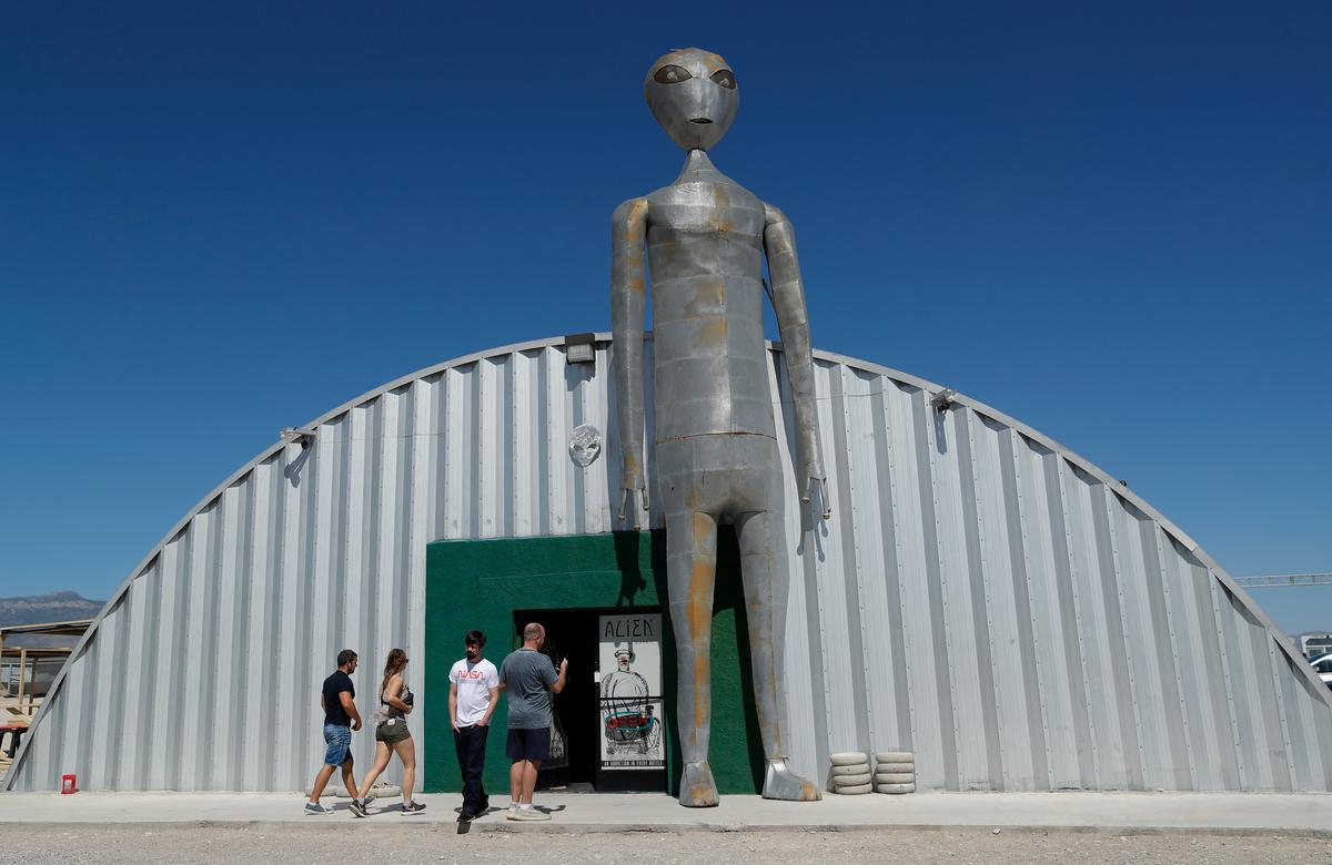 People enter and exit the Alien Research Center in Hiko, Nevada on Sept. 18, 2019. AP Photo/John Locher