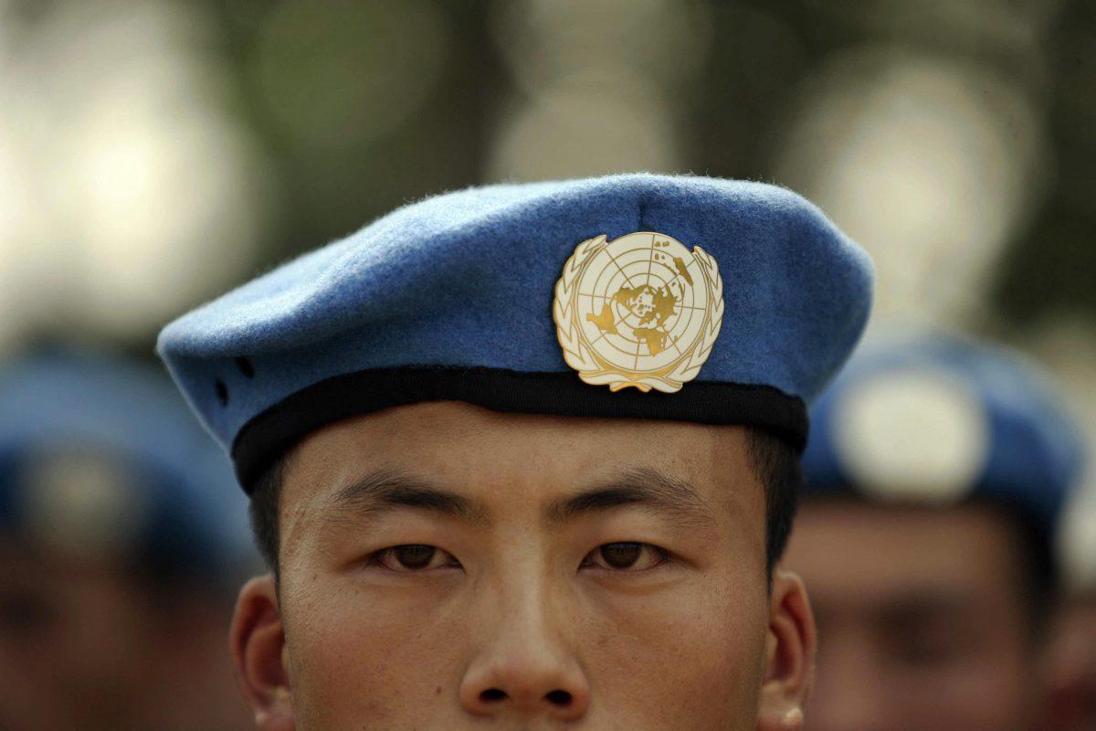People's Liberation Army (PLA) soldiers deployed for United Nations (U.N.) peace keeping missions line up at their base in China's central Henan province before being sent to Africa on Sept. 15, 2007. (Peter Parks/AFP/Getty Images)