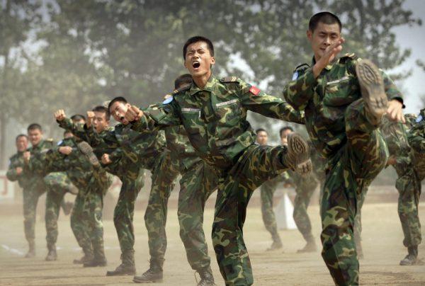 People's Liberation Army (PLA) soldiers deployed for United Nations (UN) peace keeping missions show self defense skills at their base in China's central Henan province before being sent to Africa on Sept. 15, 2007. (PETER PARKS/AFP/Getty Images)