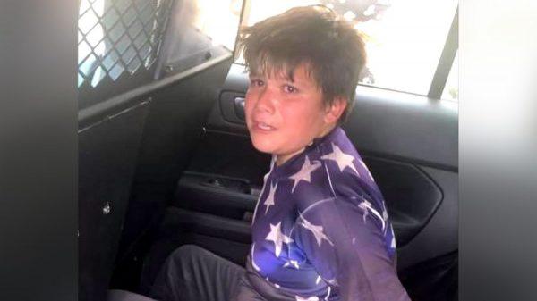 11-year-old Abraham Hibbert handcuffed. (Courtesy of Trevor Hibbert)