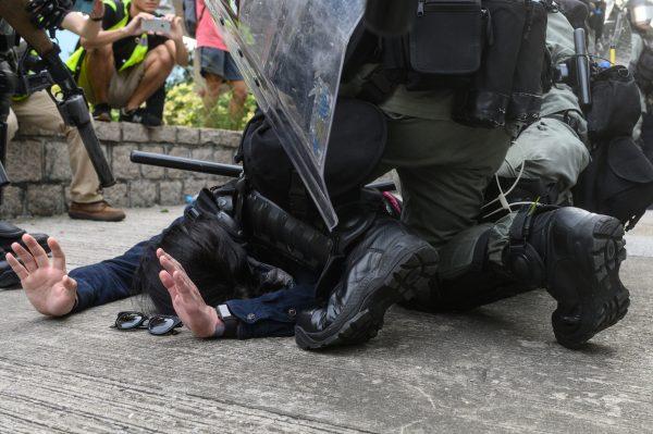 Police arrest a protester at Kowloon Bay in Hong Kong's Kwun Tong district in Hong Kong on Aug. 24, 2019. (Philip Fong/AFP/Getty Images)