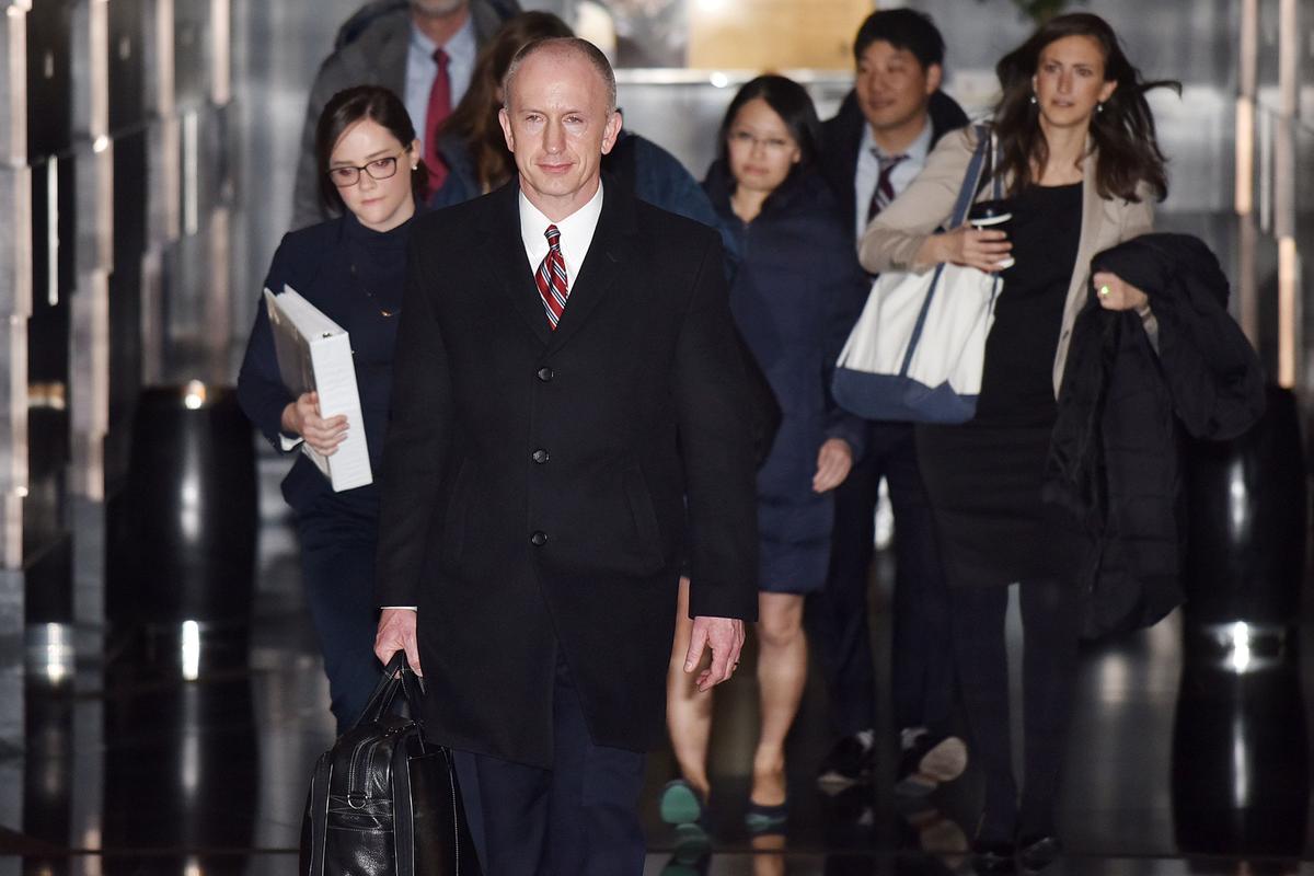 U.S. Deputy Trade Representative Jeffrey Gerrish (C) leaves a hotel with members of his negotiation team on the way to trade talks in Beijing on Feb. 12, 2019. (Greg Baker/AFP/Getty Images)