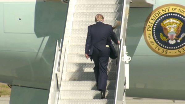 Photos and videos showed President Trump climbing the stairs to Air Force One with at least one $20 bill hanging out. (Reuters video)