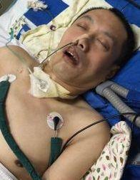 Hu Guojian in a coma at Benxi Prison. (Minghui.org)