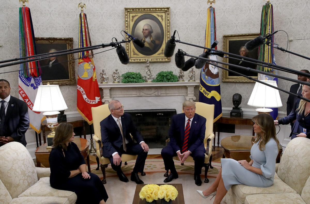U.S. President Donald Trump speaks in the Oval Office while meeting with Australian Prime Minister Scott Morrison in Washington on Sept. 20, 2019. Trump announced that the U.S. has issued new sanctions on Iran's central bank at the "highest level." Also pictured are U.S. First Lady Melania Trump (R) and the wife of the Australian prime minister, Jenny Morrison (L). (Win McNamee/Getty Images)