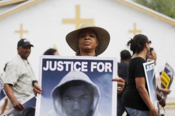 A Trayvon Martin supporter displays her sign in a file photo. (Mario Tama/Getty Images)