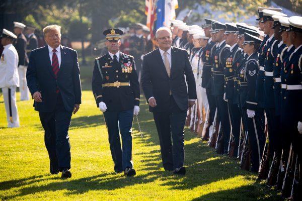 U.S. President Donald Trump (L) and Australian Prime Minister Scott Morrison (R) perform an inspection of the troops during an Official Visit by the Australian PM at the White House in Washington, DC on Sept. 20, 2019. (Photo by SAUL LOEB/AFP/Getty Images)