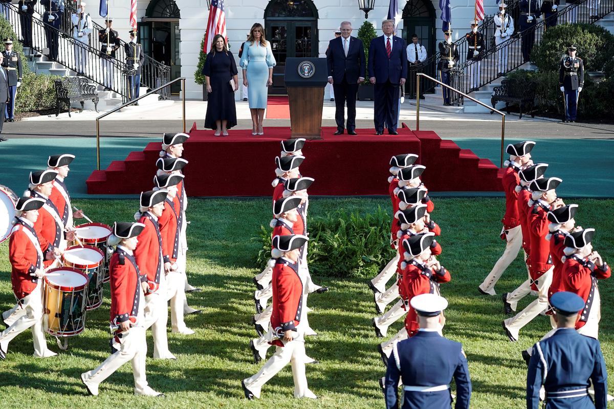 U.S. President Donald Trump and first lady Melania Trump watch the Old Guard Fife and Drum Corps pass by with Australia’s Prime Minister Scott Morrison and Jenny Morrison during an official arrival ceremony on the South Lawn of the White House in Washington, U.S., Sept. 20, 2019. (Reuters/Joshua Roberts)