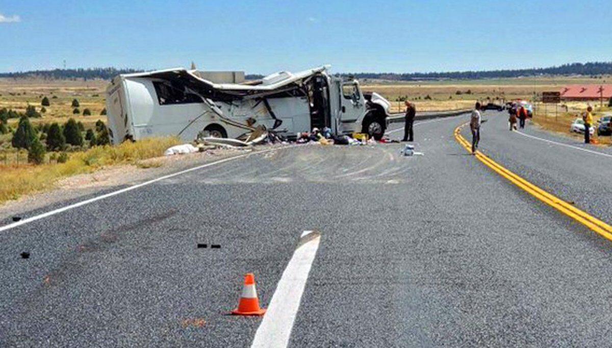 This photo released by the Garfield County Sheriff's Office shows a tour bus that was carrying Chinese-speaking tourists after it crashed near Bryce Canyon National Park in southern Utah, killing at least four people and critically injuring up to 15 others, on Sept. 20, 2019. (Sheriff Danny Perkins/Garfield County Sheriff's Office via AP)