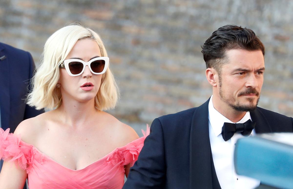 Singer Katy Perry and actor Orlando Bloom arrive to attend the wedding of fashion designer Misha Nonoo at Villa Aurelia in Rome, Italy, on Sept. 20, 2019. (REUTERS/Yara Nardi)