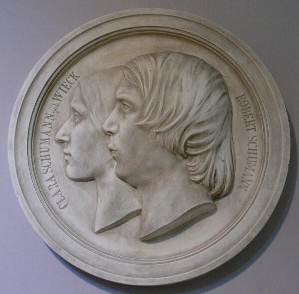Portrait medallion of Clara and Robert Schumann, after Ernst Rietschel, 1846.<br/>Berlin Musical Instrument Museum. (Public Domain)