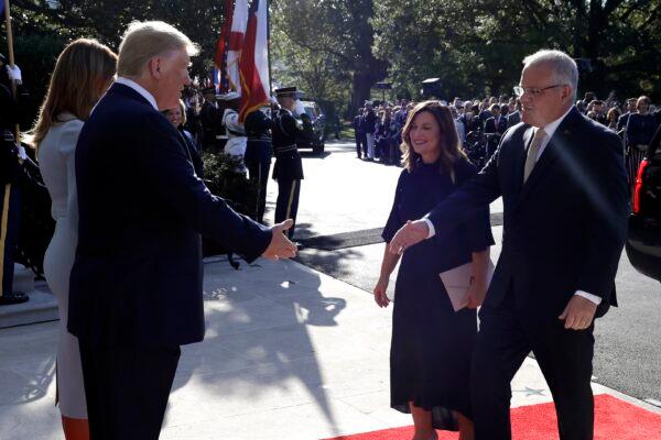 President Donald Trump and first lady Melania Trump welcome Australian Prime Minister Scott Morrison and his wife Jenny Morrison during a State Arrival Ceremony on the South Lawn of the White House, Friday, Sept. 20, 2019, Washington. (AP Photo/Evan Vucci)