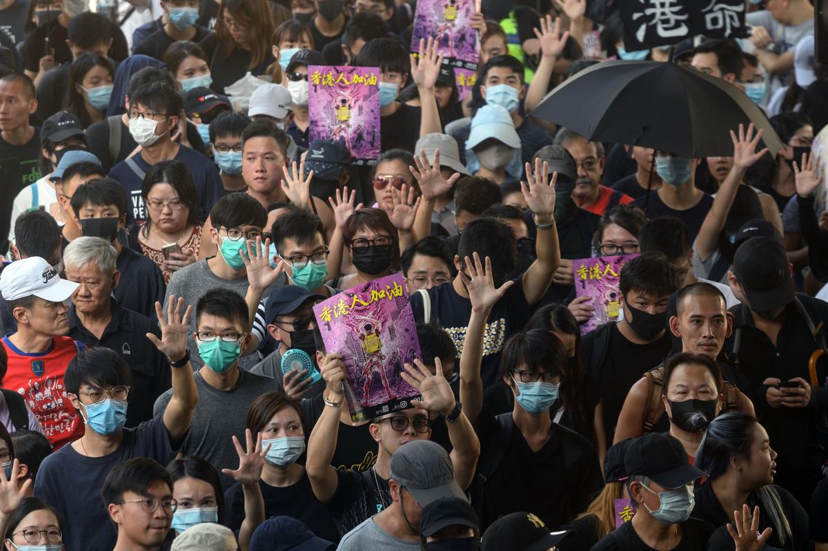 Demonstrators hold up their hands to symbolize the five demands that protesters are asking for, as they take part in a pro-democracy rally in Hong Kong's Tuen Mun district on Sept. 21, 2019. (Philip Fong/AFP/Getty Images)