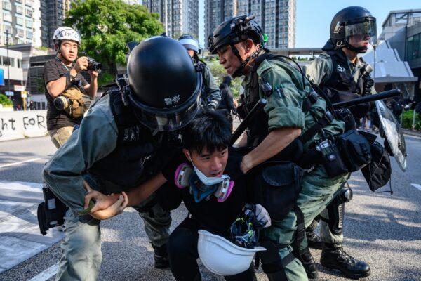 A man is detained by police during a protest in Hong Kong's Tuen Mun district on Sept. 21, 2019. (Philip Fong/AFP/Getty Images)