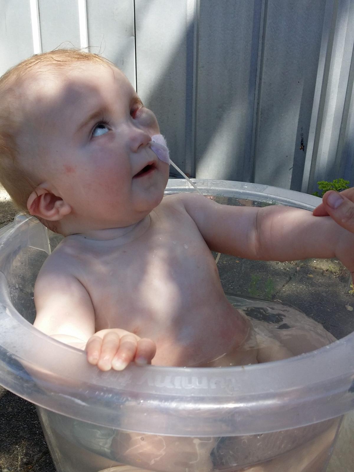 Eva having a much-needed cool bath after a hot day in February 2015. (Photo courtesy of <a href="http://theoneinamillionbaby.com/">Tessa Prebble</a>)