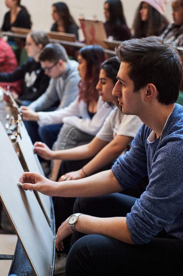 Young students in the historic Life Room at the Royal Academy of Art in London draw from life. (Justine Trickett)