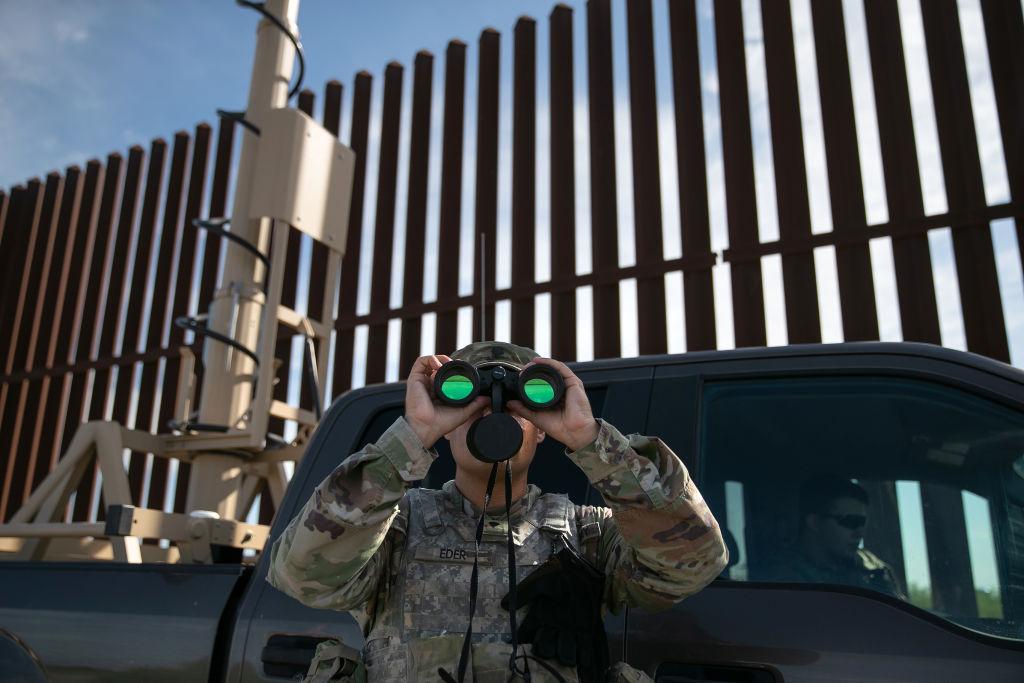 An active-duty U.S. Army soldier scans for undocumented immigrants while on duty manning a high-res surveillance camera near the U.S.-Mexico border fence in Penitas, Texas, on Sept. 10, 2019. (John Moore/Getty Images)