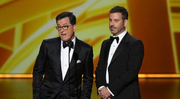 Stephen Colbert and Jimmy Kimmel speak onstage during the 71st Emmy Awards at Microsoft Theater in Los Angeles, Calif., on Sept. 22, 2019. Reports say Kimmel's and Colbert's shows will go dark during the strike. (Kevin Winter/Getty Images)