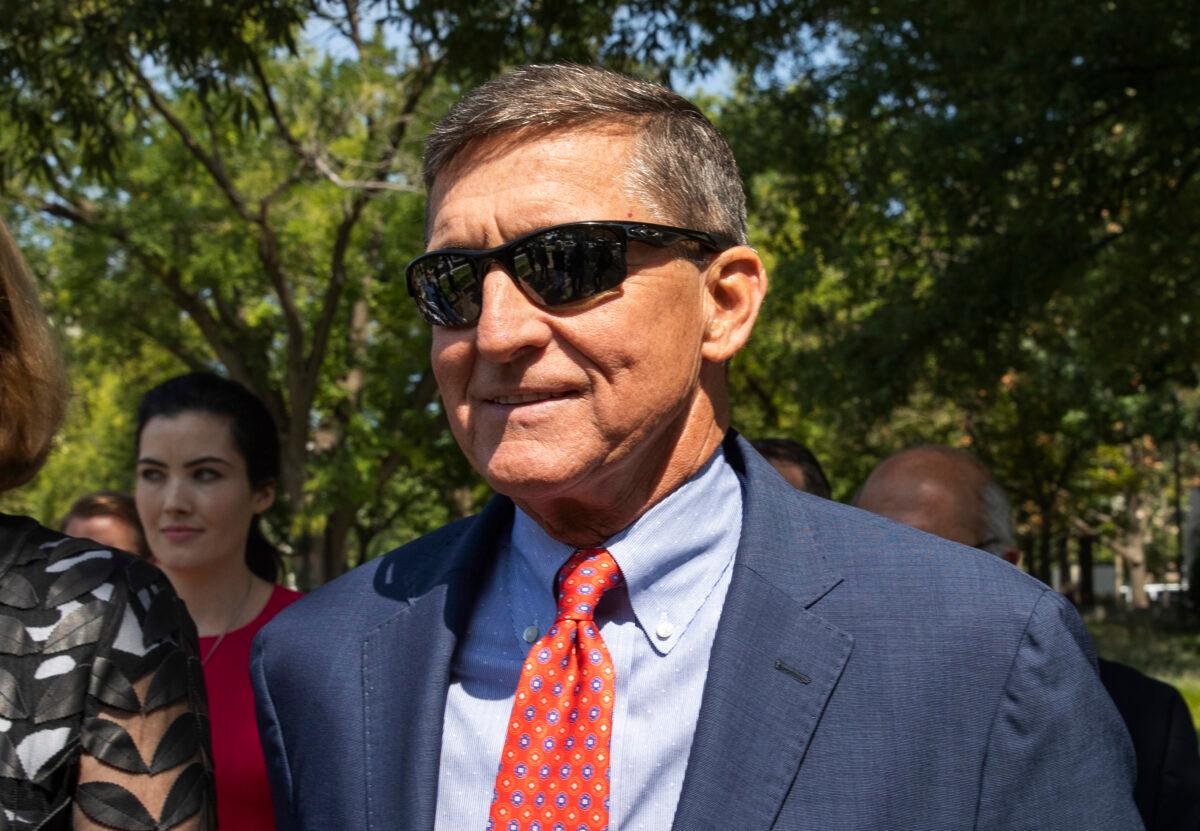 Michael Flynn, President Donald Trump's former national security adviser, leaves the federal court with his lawyer Sidney Powell, left, following a status conference with Judge Emmet Sullivan, in Washington on Sept. 10, 2019. (Manuel Balce Ceneta/AP Photo)