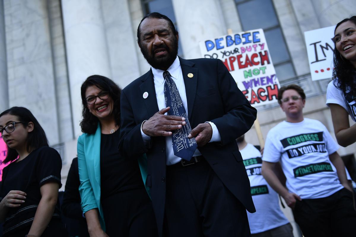 Rep. Al Green (D-Texas), speaks as Rep. Rashida Tlaib (D-Mich.) looks on during a protest asking for impeachment of US President Trump on Capitol Hill in Washington on Sept. 23, 2019. (Brendan Smialowski/AFP/Getty Images)