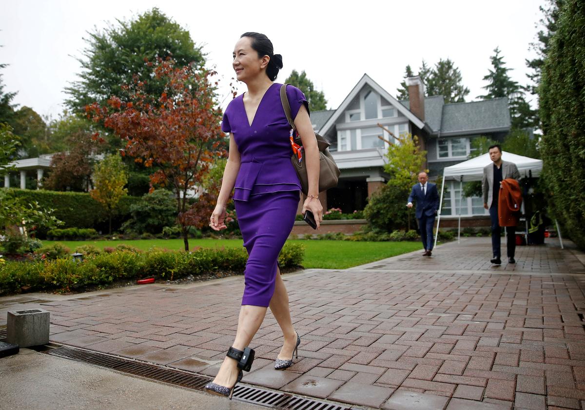 Meng Wanzhou leaves her home to appear for a hearing at British Columbia supreme court, in Vancouver, British Columbia, Canada on Sept. 23, 2019. (Lindsey Wasson/Reuters)