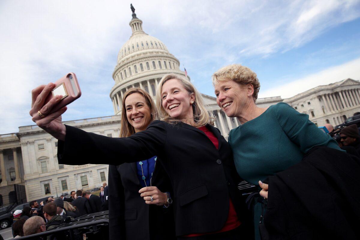 (L-R) Reps. Mikie Sherrill (D-N.J.), Abigail Spanberger (D-Va.), and Chrissy Houlahan (D-Penn.) take a selfie in front of the U.S. Capitol in a file photograph. Sherrill and Spanberger said on Sept. 23, 2019, they support impeaching President Donald Trump if an investigation finds he improperly pressured Ukraine to probe former Vice President Joe Biden. (Win McNamee/Getty Images)