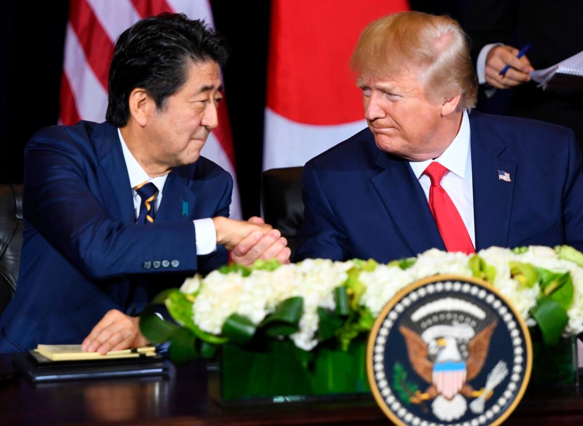U.S. President Donald Trump and Japanese Prime Minister Shinzo Abe shake hands during a meeting on trade in New York on the sidelines of the United Nations General Assembly, on Sept. 25, 2019. (Saul Loeb/AFP/Getty Images)