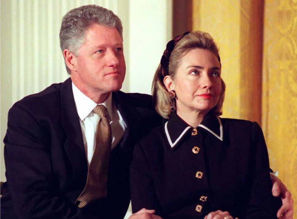 President Bill Clinton (L) and his wife Hillary listen to speakers at a Coalition for America's Children event at the White House in Washington on March 3, 1997. (Joyce Naltchayan/AFP/Getty Images)
