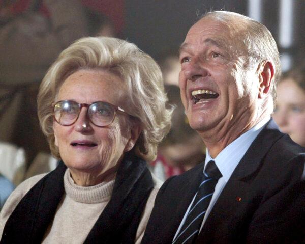 Former French President Jacques Chirac (R) and his wife Bernadette attend the traditional Christmas tree party at the Elysee Palace in Paris on Dec.15, 2004. (Charles Platiau, pool photo via AP, File)