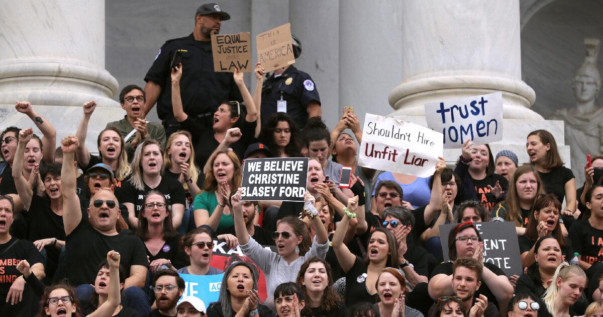 Hundreds of protesters occupy the center steps of the East Front of the U.S. Capitol after breaking through barricades to demonstrate against the confirmation of Supreme Court nominee Judge Brett Kavanaugh Oct. 06, 2018, in Washington.(Chip Somodevilla/Getty Images)