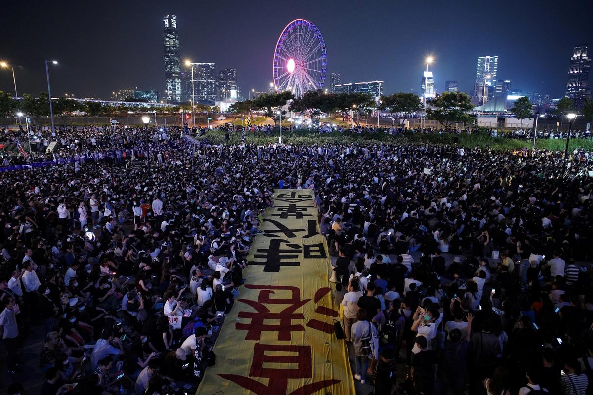 Protesters attend a rally at Edinburgh Place to show solidarity for arrested political activists being held at San Uk Ling detention center in Hong Kong, China on Sept. 27, 2019. (Athit Perawongmetha/Reuters)