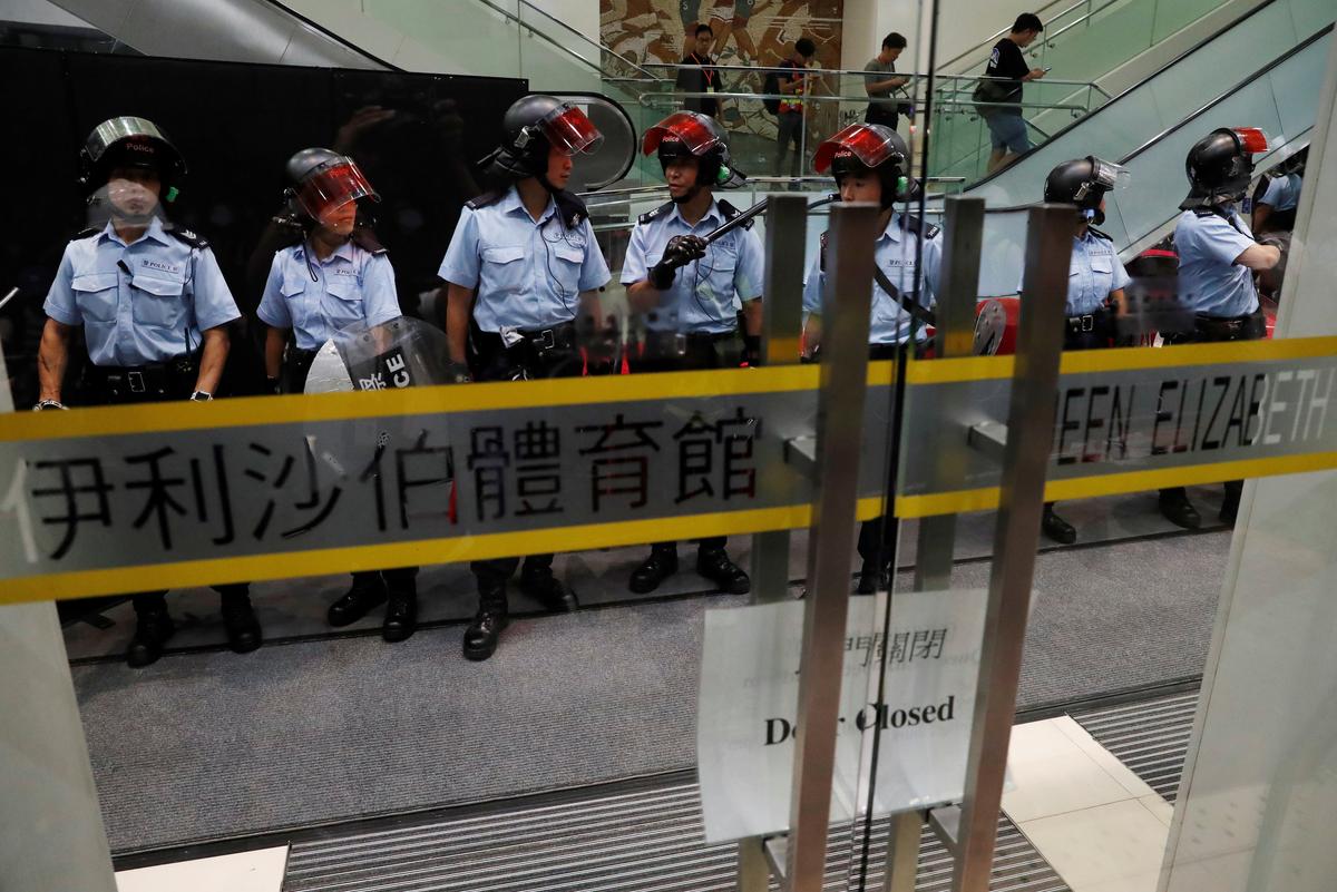 Riot police stand guard at the venue of first community dialogue held by Hong Kong Chief Executive Carrie Lam in Hong Kong, China on Sept. 26, 2019. (Tyrone Siu/Reuters)