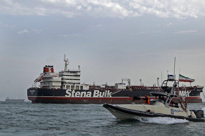 A speedboat of the Iran's Revolutionary Guard moves around a British-flagged oil tanker Stena Impero, which was seized by the Guard, in the Iranian port of Bandar Abbas. (Hasan Shirvani/Mizan News Agency via AP, File)