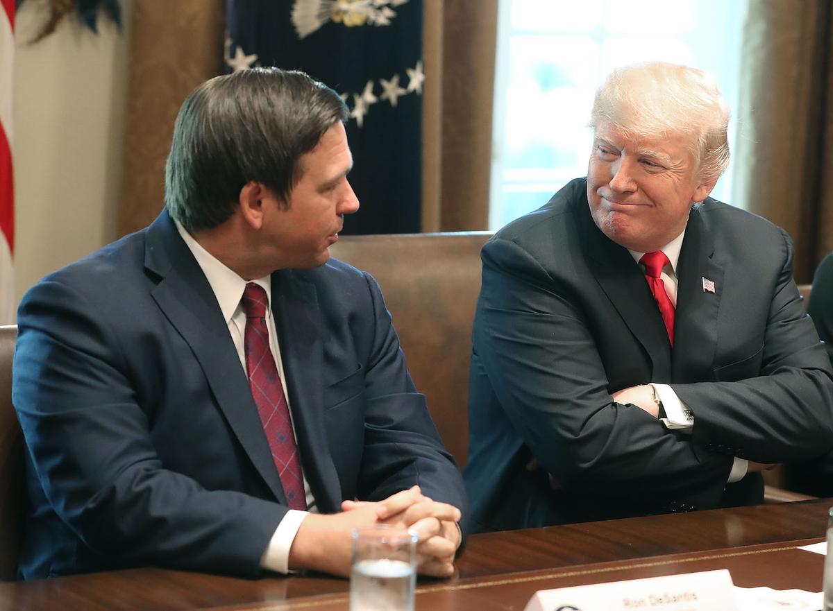 Florida Governor-elect Ron DeSantis (R) sits next to U.S. President Donald Trump during a meeting with Governors elects in the Cabinet Room at the White House in Washington on Dec. 13, 2018. (Mark Wilson/Getty Images)