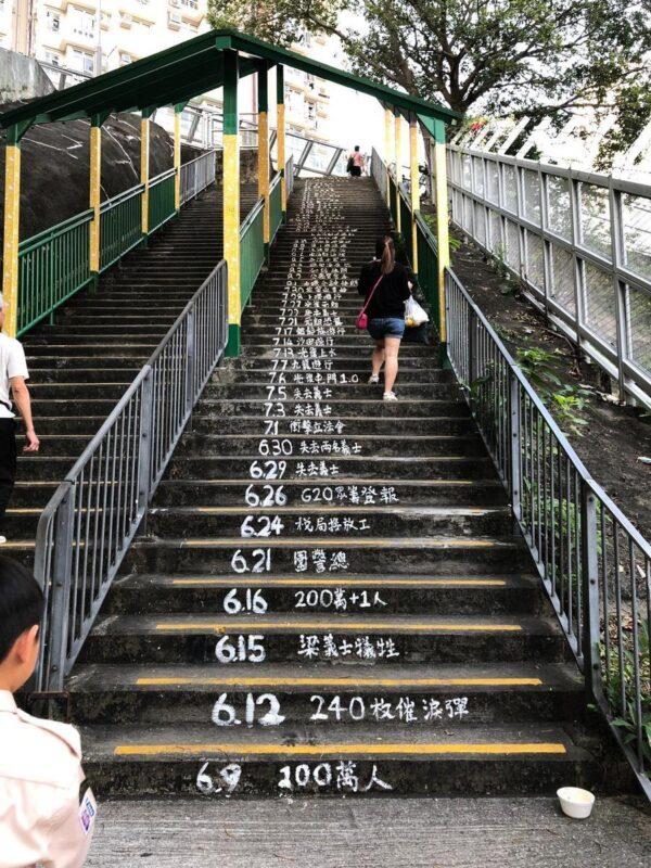 Hong Kong protesters recorded the development of the protests since June on stairs of a sky bridge on Sept. 28, 2019. (Yu Kong/The Epoch Times)