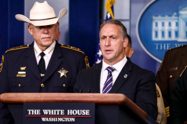 Acting ICE Director Matthew Albence, flanked by sheriffs and law enforcement officials at a press briefing in the White House in Washington on Sept. 26, 2019. (Charlotte Cuthbertson/The Epoch Times)