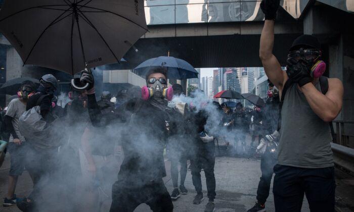 As Hong Kong Protesters March in Unauthorized Rally, Police Ratchet Up Tactics