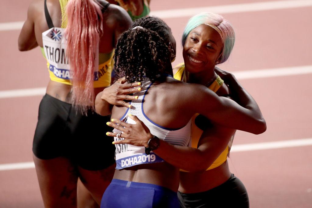 Gold medalist Fraser-Pryce and silver medalist Asher-Smith embrace after the race. (©Getty Images | <a href="https://www.gettyimages.com.au/detail/news-photo/gold-medalist-shelly-ann-fraser-pryce-of-jamaica-and-silver-news-photo/1177933291">Christian Petersen</a>)
