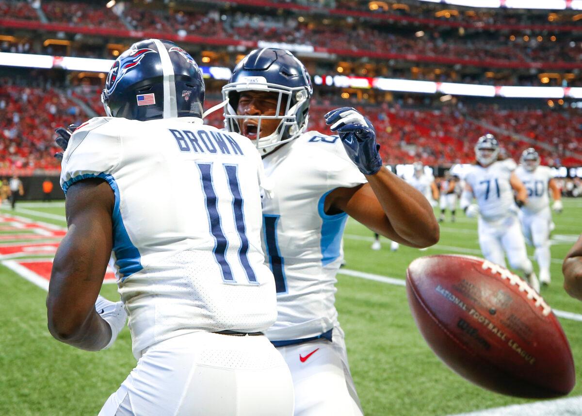 A.J. Brown #11 and Jonnu Smith #81 of the Tennessee Titans celebrate after Brown scored a touchdown in the first half of an NFL game against the Atlanta Falcons at Mercedes-Benz Stadium in Atlanta, Georgia, on Sept. 29, 2019. (Todd Kirkland/Getty Images)