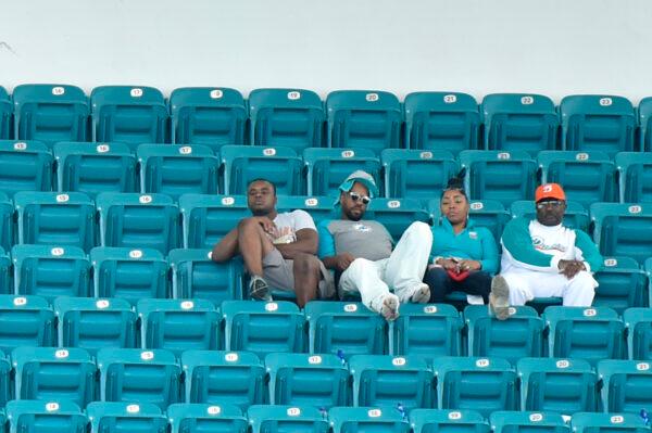 Miami Dolphins fans sit in the upper deck during the fourth quarter of the game against the Los Angeles Chargers at Hard Rock Stadium in Miami, Fla on Sept. 29, 2019. (Eric Espada/Getty Images)