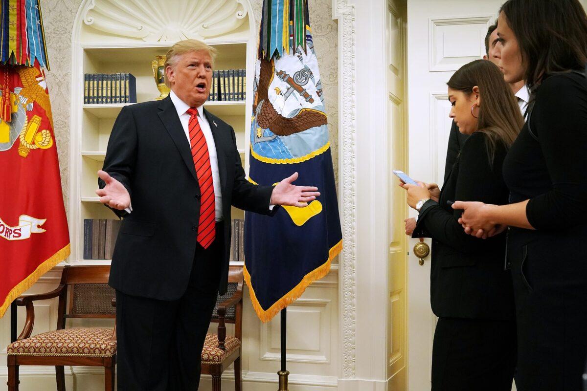 President Donald Trump gives pause to answer a reporters' question about a whistleblower as he leaves the Oval Office in Washington on Sept. 30, 2019. (Photo by Chip Somodevilla/Getty Images)
