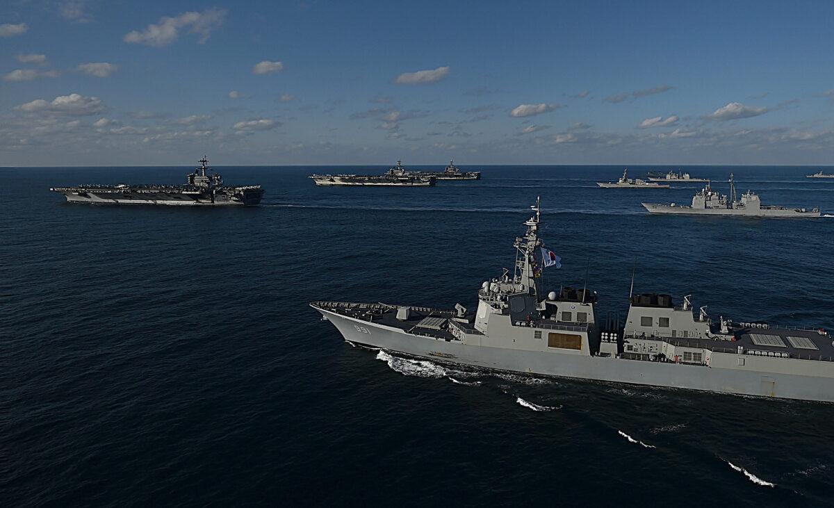 In this handout image released September 13 by South Korean Defense Ministry, USS Nimitz (3rd L), USS Ronald Reagan (2nd L) and USS Theodore Roosevelt (L) conducting operations with South Korea's destroyers during a joint naval drill in East Sea, South Korea on Nov. 12, 2017. (South Korean Defense Ministry via Getty Images)