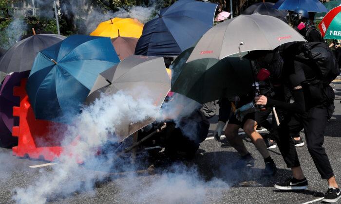Hong Kong Police Fire Water Cannon, Tear Gas as Protests Spread on CCP Anniversary