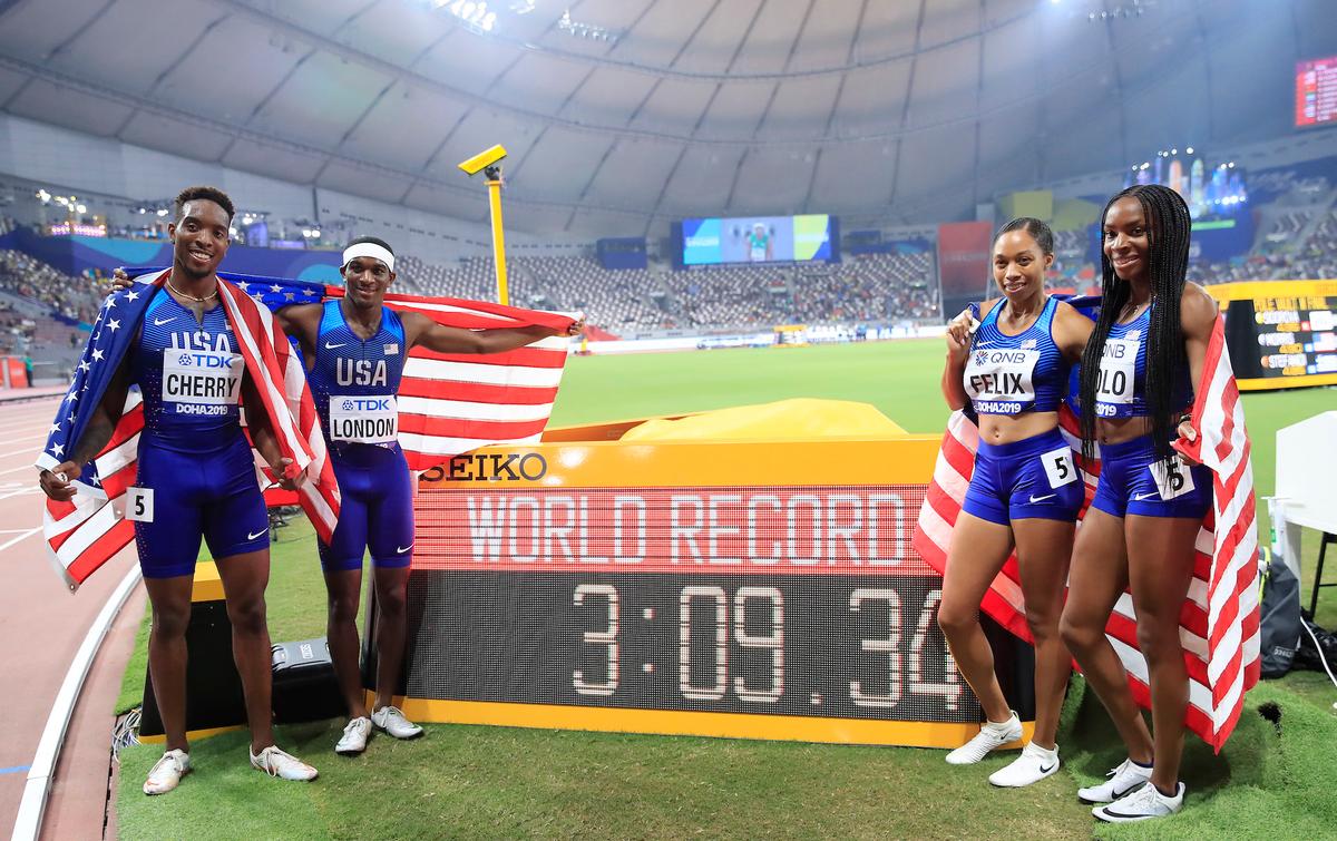 Wilbert London, Michael Cherry, Courtney Okolo, and Allyson Felix of the United States pose after setting a new world record in the 4x400 meter mixed relay during day three of 17th IAAF World Athletics Championships Doha 2019 at Khalifa International Stadium in Doha, Qatar, on Sept. 29, 2019. (Michael Steele/Getty Images)