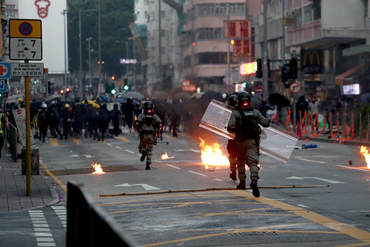 Riot police advance during a protest in Sham Shui Po district in Hong Kong on Oct. 1, 2019. (Athit Perawongmetha/Reuters)