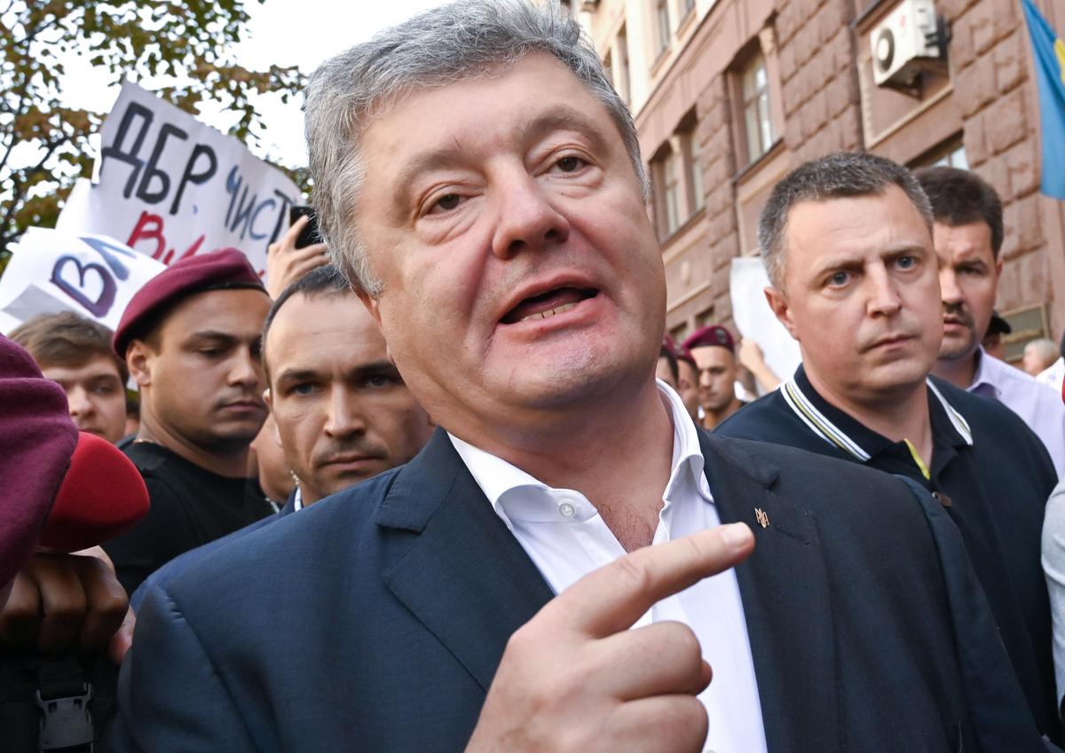 Former Ukrainian President and current leader of the European Solidarity Party, Petro Poroshenko, leaves the State Bureau of Investigation in Kyiv on Aug. 12, 2019, after he was questioned as a witness in a case of possible tax evasion during the purchase of the TV station Pryamyi. (Sergei Supinsky/AFP/Getty Images)